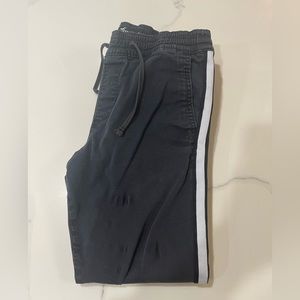 Black holister sweatpants with white stripe